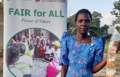 Grassroot woman showcasing her cassava value added products.